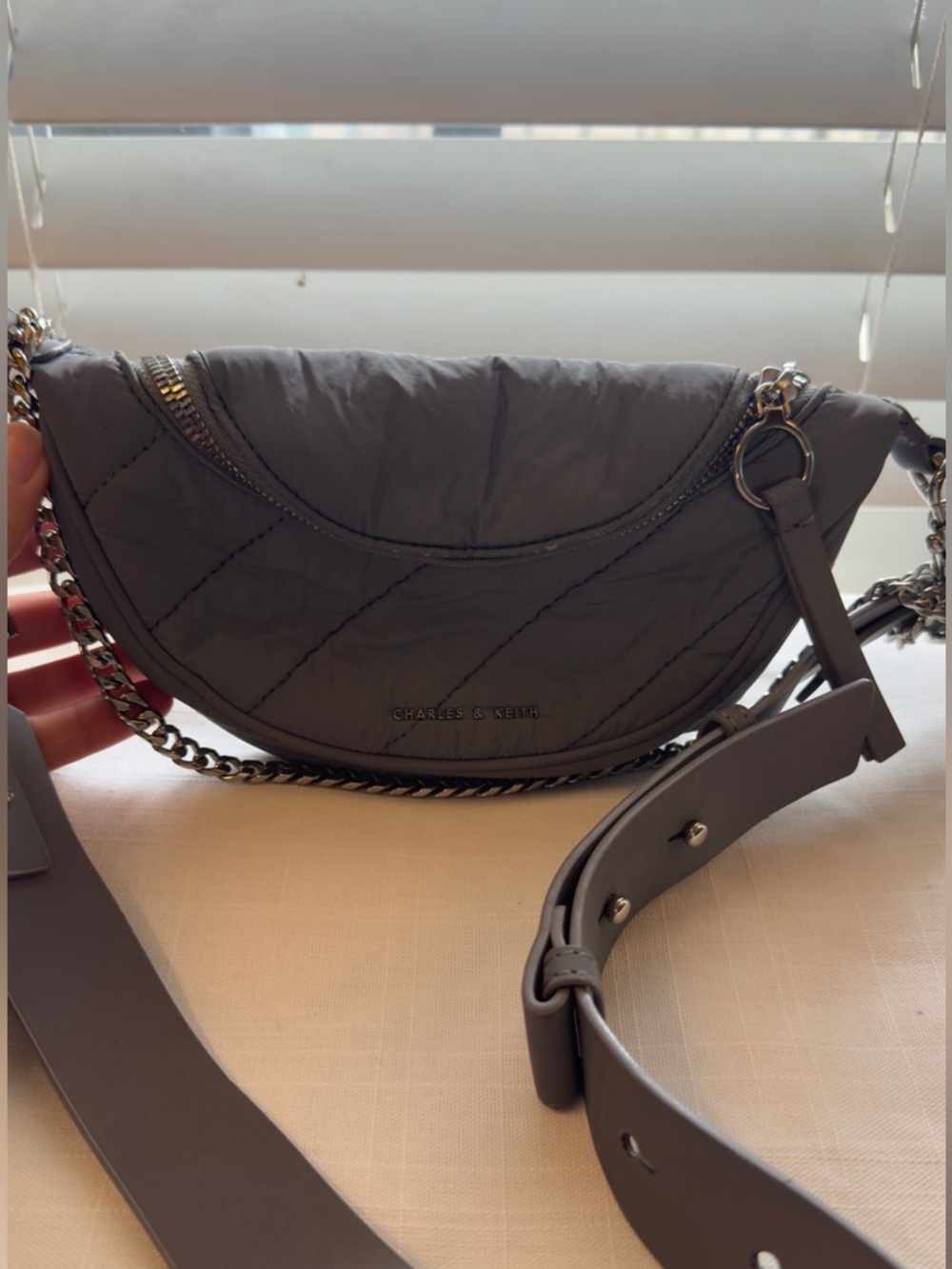 Charles & Keith Quilted Padded Half-Moon Crossbody Bag - Grey